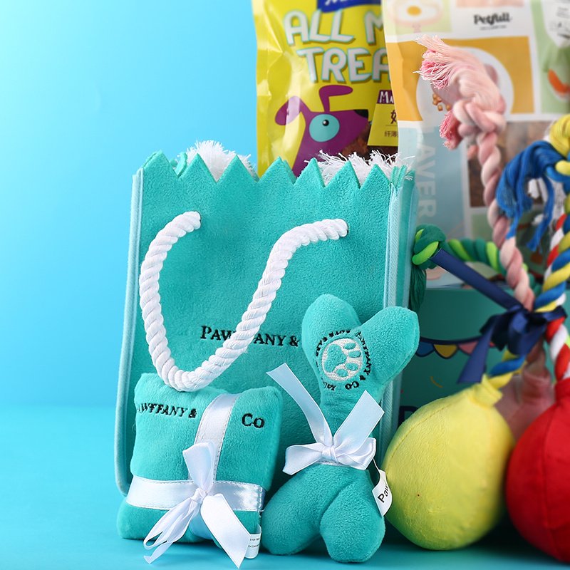 bolsa-regalo-juguetes-perros-raijuu-04.jpg Bolsa de regalo, con un hueso y un cojín, azules y con decoración