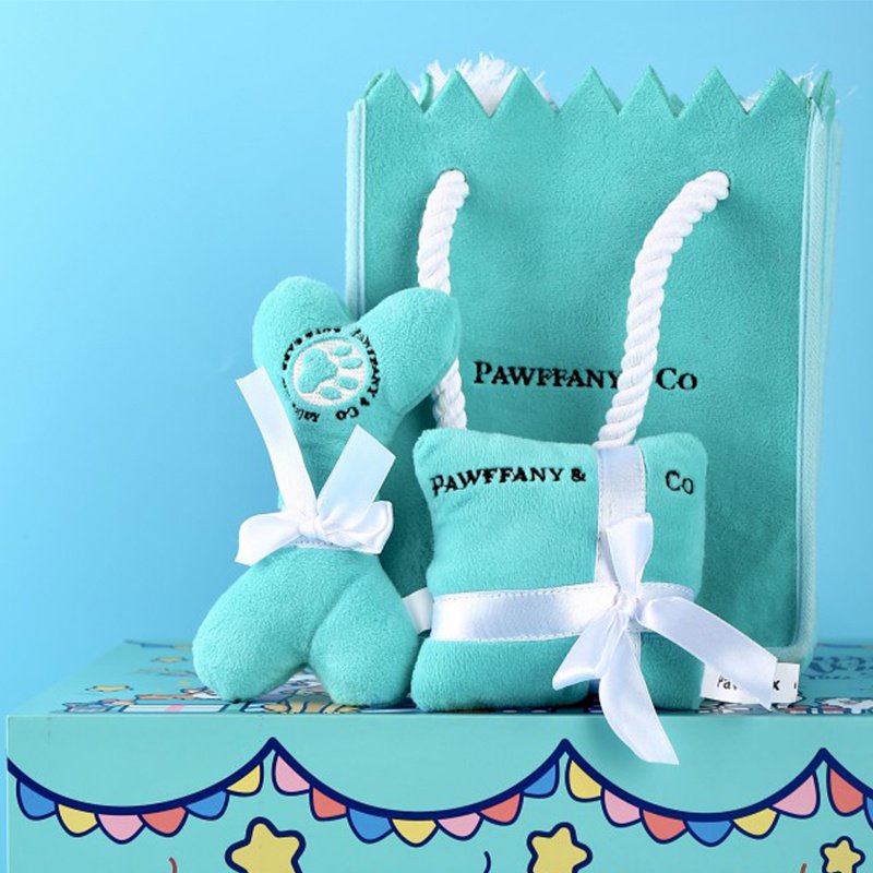 bolsa-regalo-juguetes-perros-raijuu-06.jpg Bolsa de regalo, con un hueso y un cojín, azules y con decoración